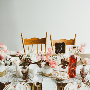 A table set with party flowers by Toronto florist Periwinkle Flowers.